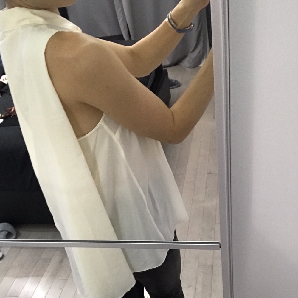 BCBG silk top ..diamond shaped buttons cape back